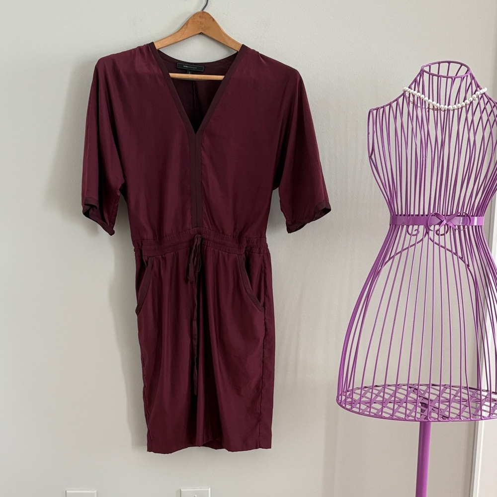 BCBGMaxAzria Burgundy V-Neck Midi Dress tie waist that is adjustable.